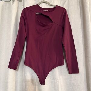 Abercrombie & Fitch Soft AF Cut Out long-sleeve Thong bodysuit in a burgundy
